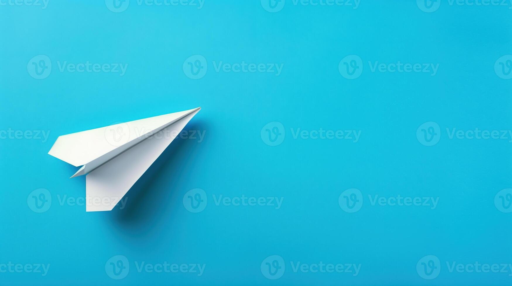 paper airplane on blue background photo