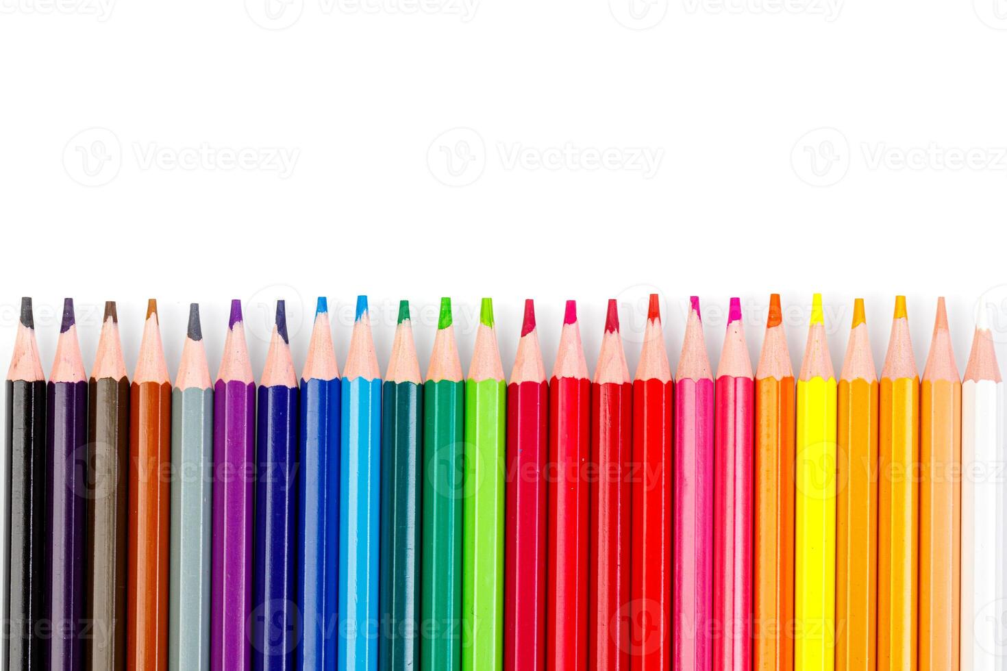 macro multicolored pencils on a white background photo