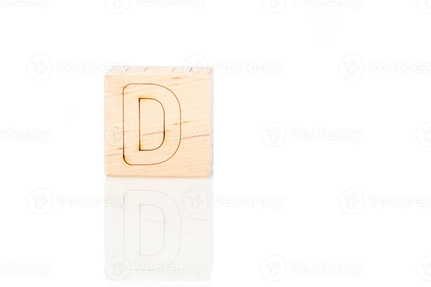 Wooden cubes with letters D on a white background photo