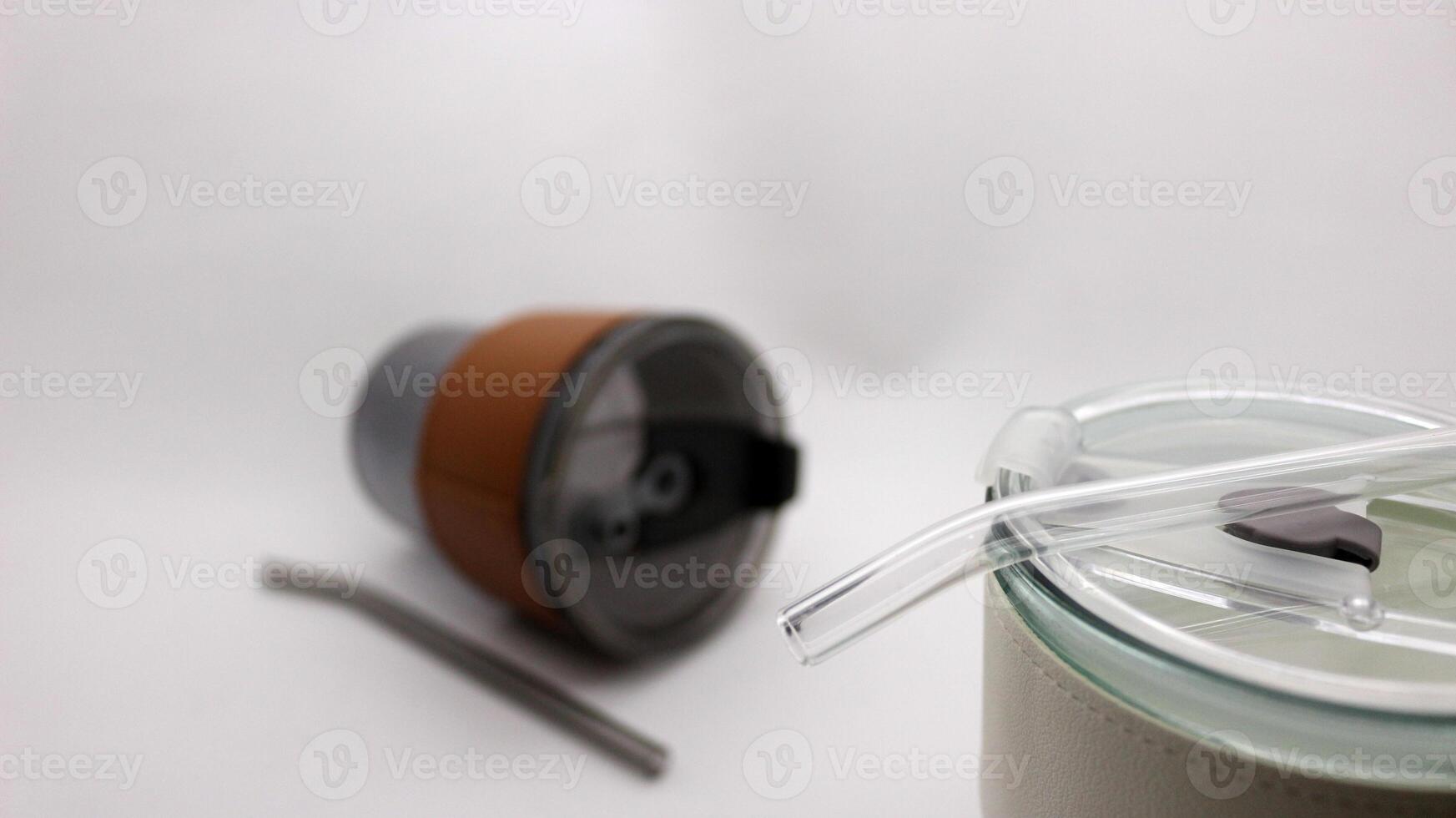 Tumbler in the form of a glass or glass mug with a modern design photo