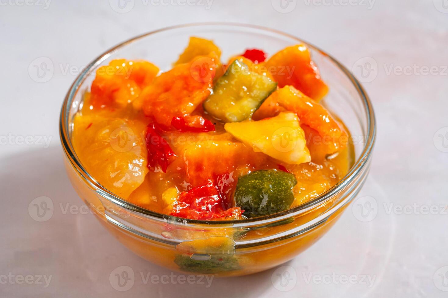 Rujak aceh or Rojak is dish from Java. Rujak consists of a mixture of sliced fruit and vegetables served with spicy palm sugar sauce. photo