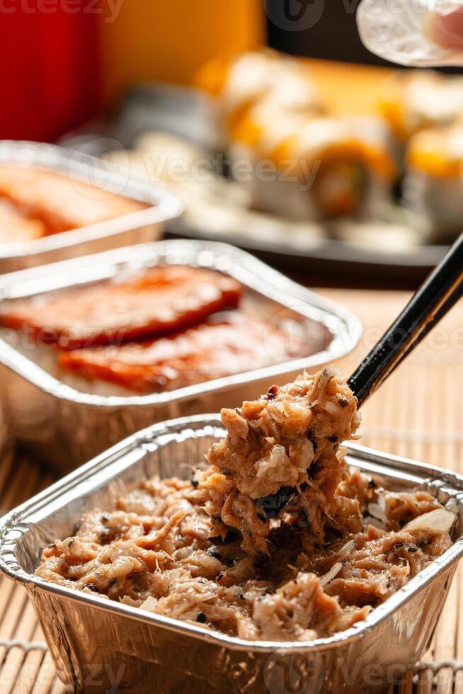 sushi is a Japanese dish of prepared vinegared rice, usually with some sugar and salt, accompanied by a variety of ingredients such as seafood, often raw and vegetables. photo
