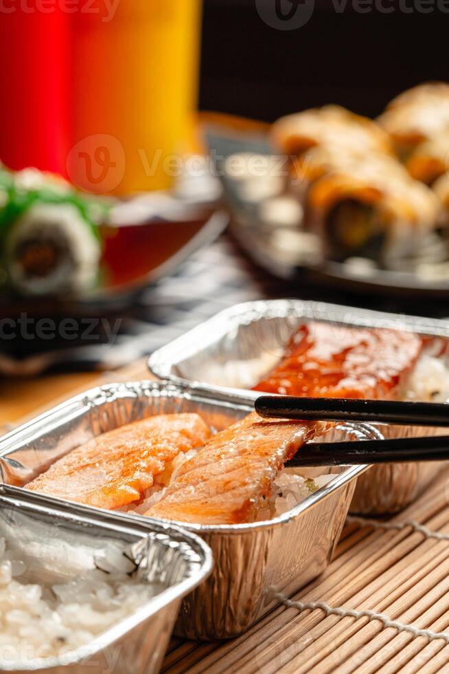 sushi is a Japanese dish of prepared vinegared rice, usually with some sugar and salt, accompanied by a variety of ingredients such as seafood, often raw and vegetables. photo