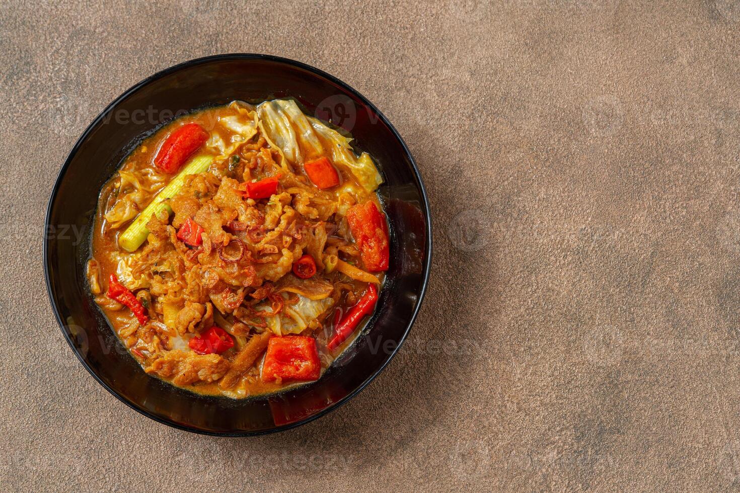Tongseng is beef stew dish in curry-like soup, with vegetables and sweet soy sauce photo