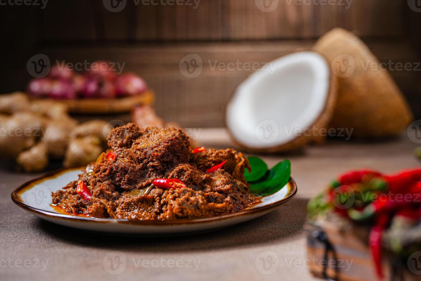 Rendang Pork. Rendang is an Indonesian West Sumatra Minangkabau spicy meat. that slow cooked in coconut milk and mixed spices. photo