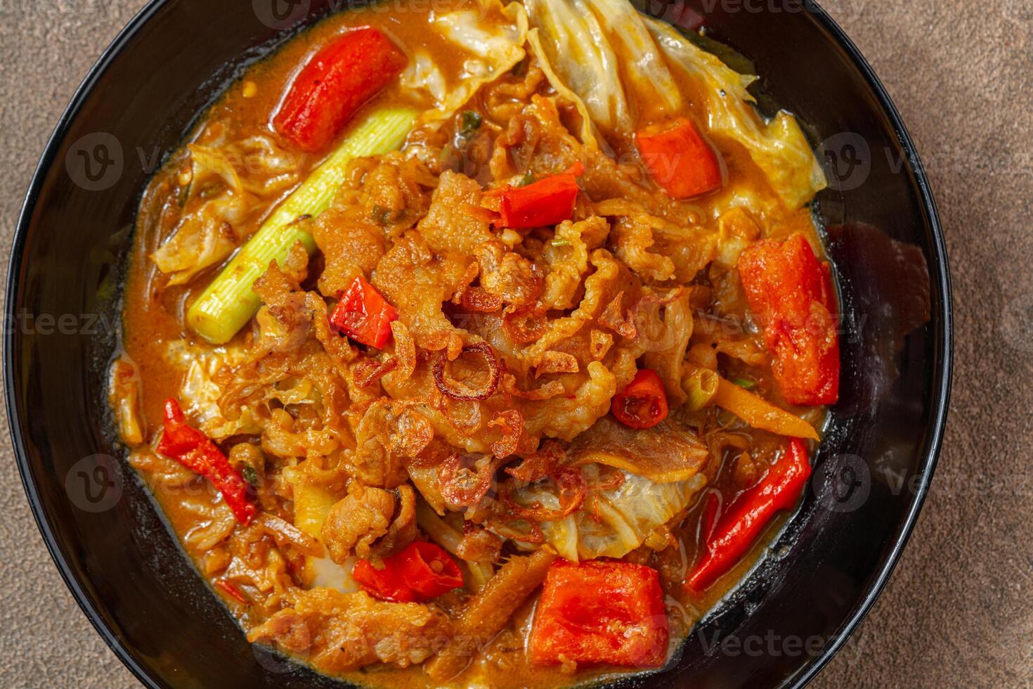 Tongseng is beef stew dish in curry-like soup, with vegetables and sweet soy sauce photo