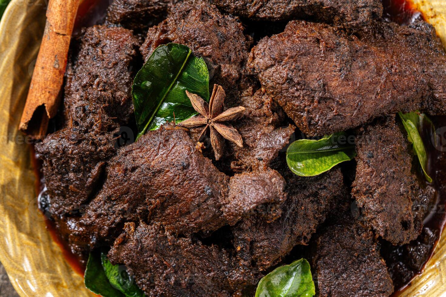 Beef Rendang is a Minang dish originating from the Minangkabau region in West Sumatra, Indonesia photo