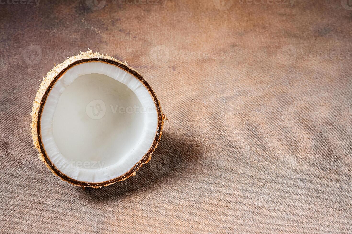 Raw Coconut on wood background photo