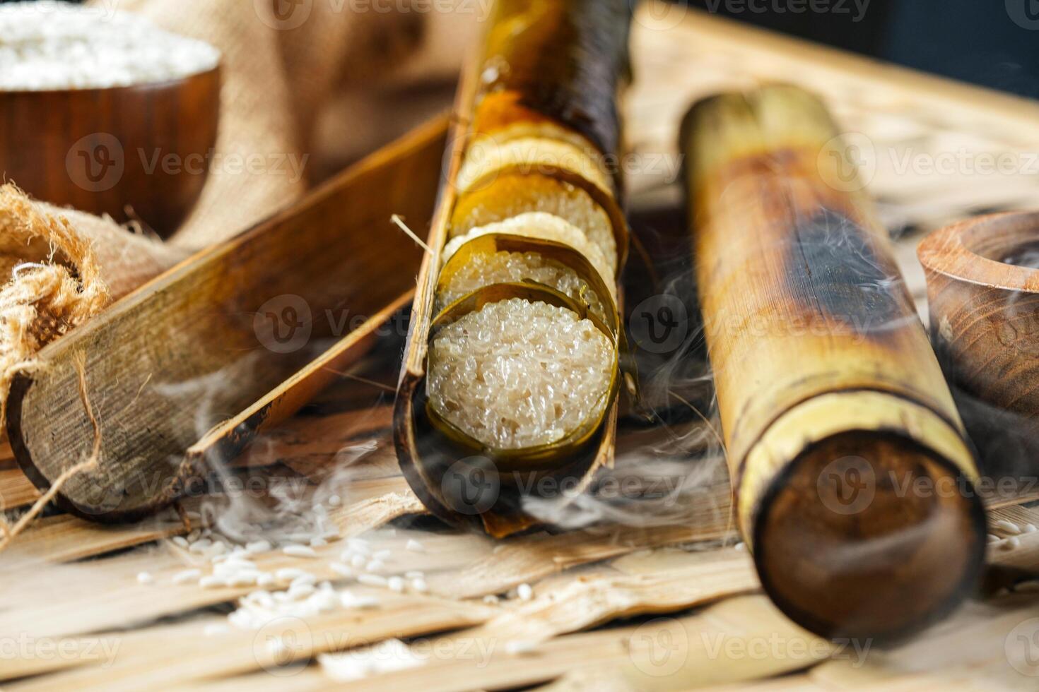Lemang. Glutinous rice is wrapped with lerek or banana leaf encased in bamboo culm and cooked in open fire. photo