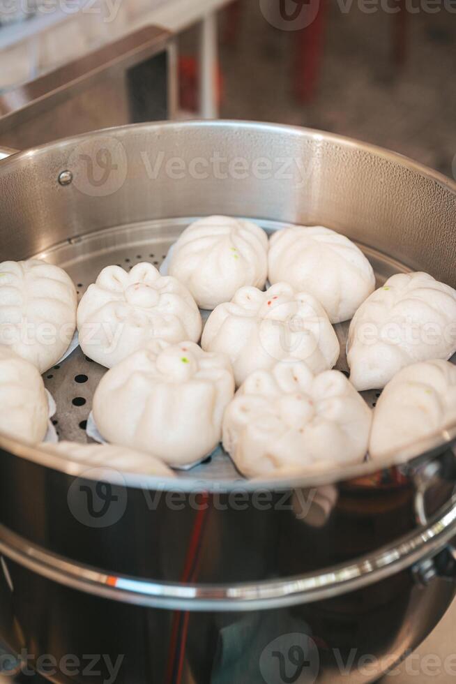 Baozi or Bakpao is a type of yeast-leavened filled bun in various Chinese cuisines. photo