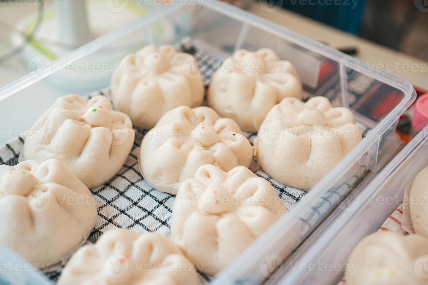 Baozi or Bakpao is a type of yeast-leavened filled bun in various Chinese cuisines. photo