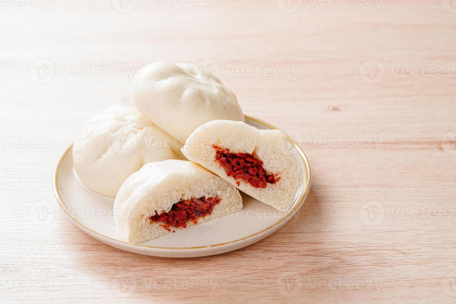 Baozi or Bakpao is a type of yeast-leavened filled bun in various Chinese cuisines. photo