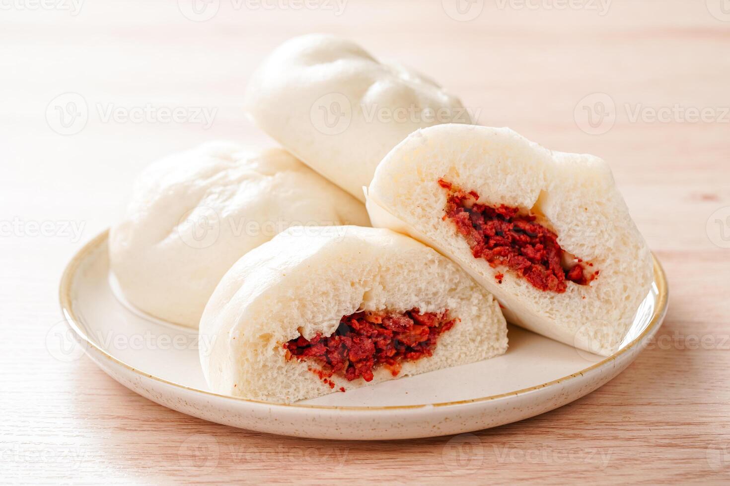 Baozi or Bakpao is a type of yeast-leavened filled bun in various Chinese cuisines. photo