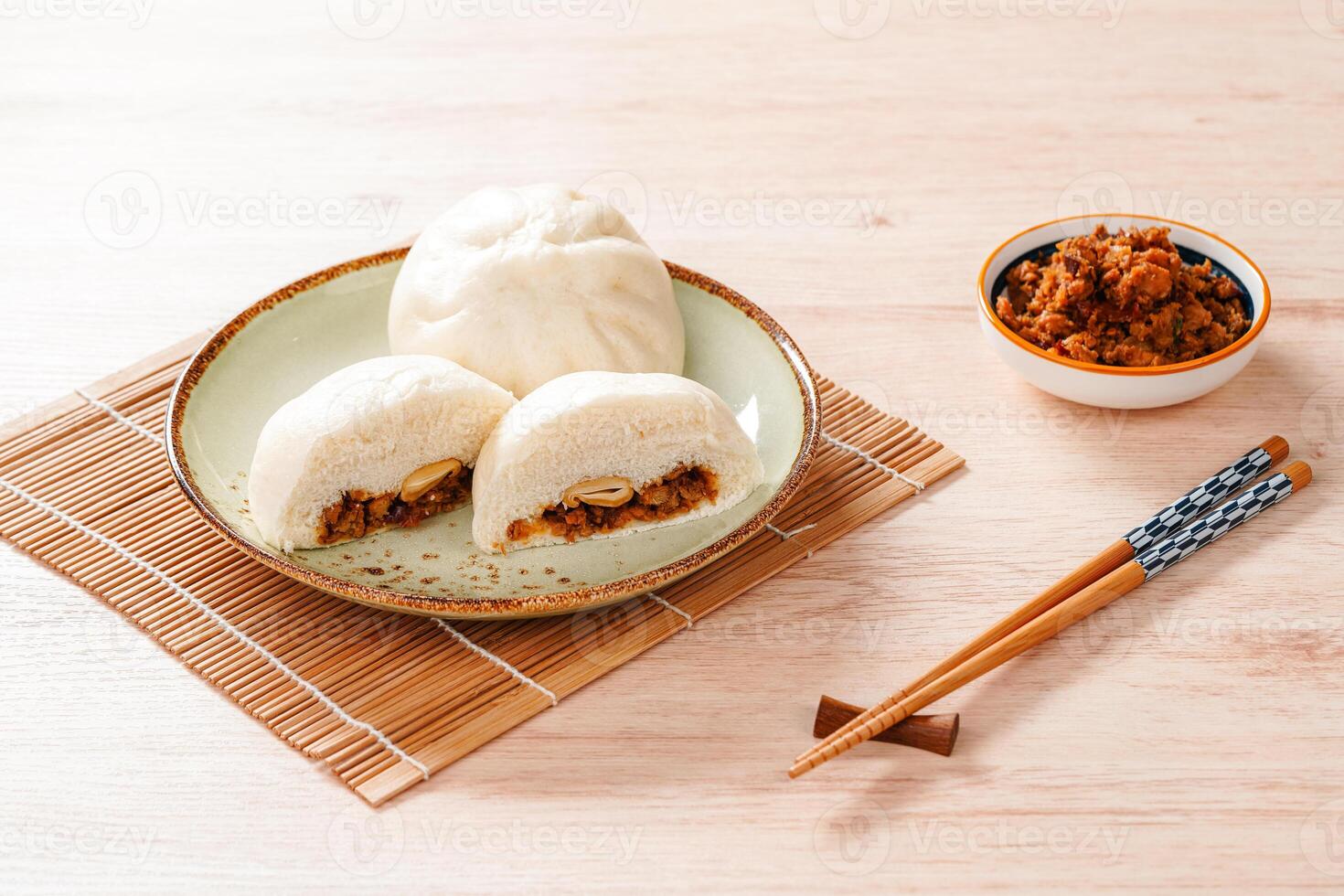 Baozi or Bakpao is a type of yeast-leavened filled bun in various Chinese cuisines. photo