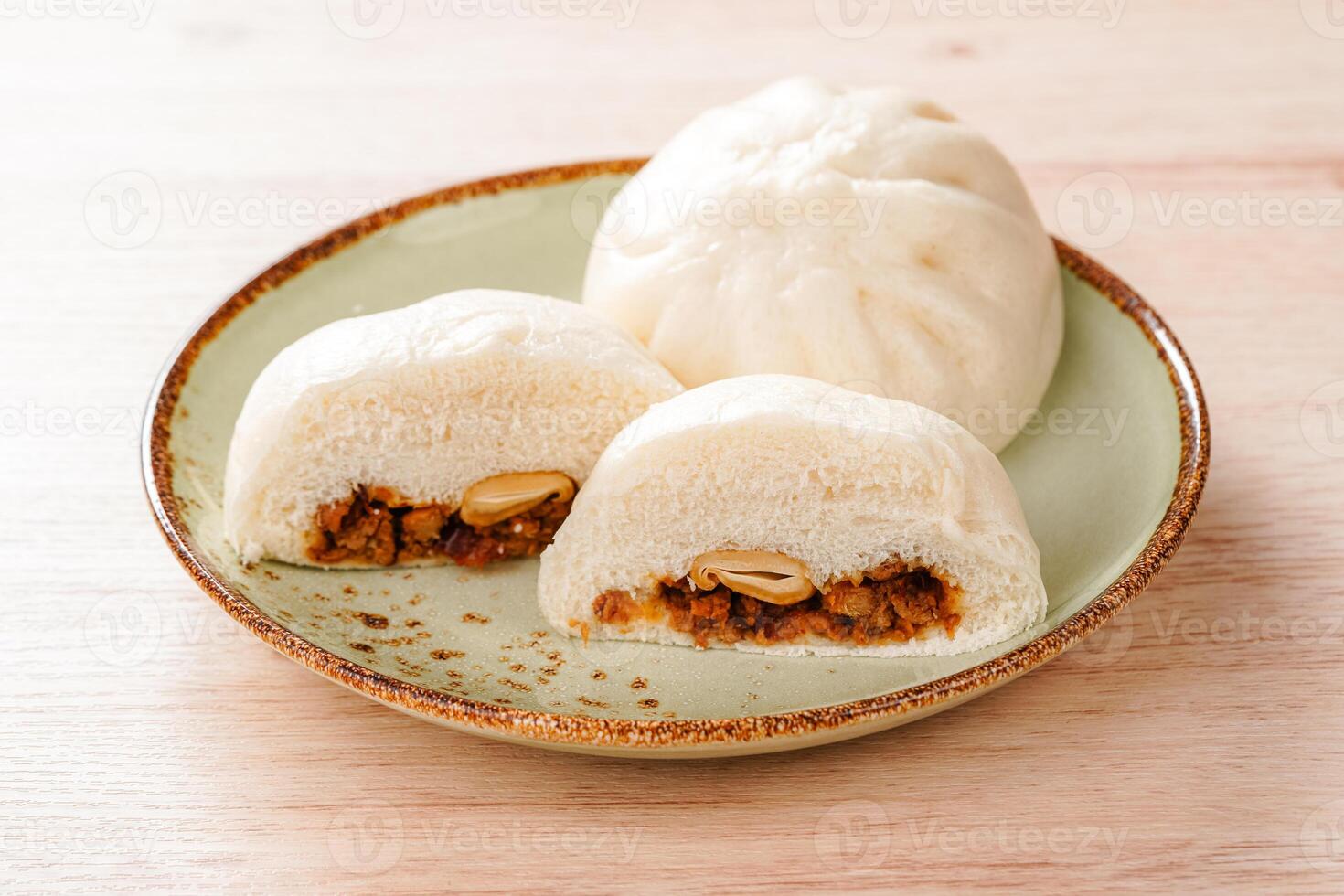 Baozi or Bakpao is a type of yeast-leavened filled bun in various Chinese cuisines. photo