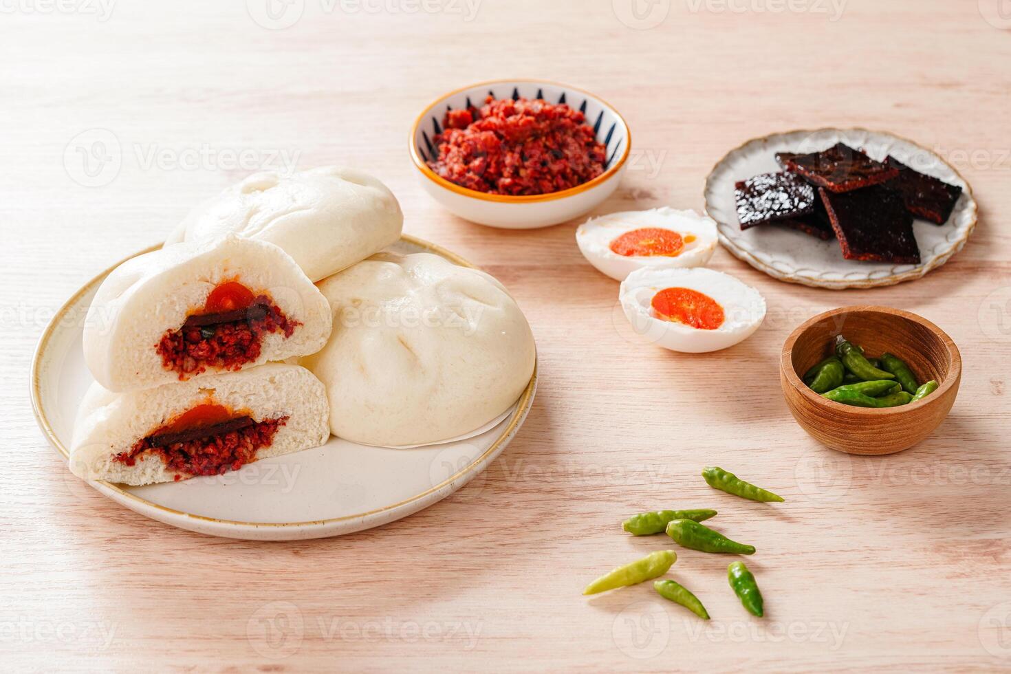 Baozi or Bakpao is a type of yeast-leavened filled bun in various Chinese cuisines. photo