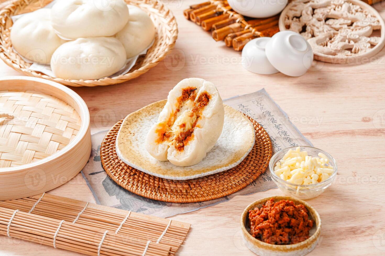 Baozi or Bakpao is a type of yeast-leavened filled bun in various Chinese cuisines. photo