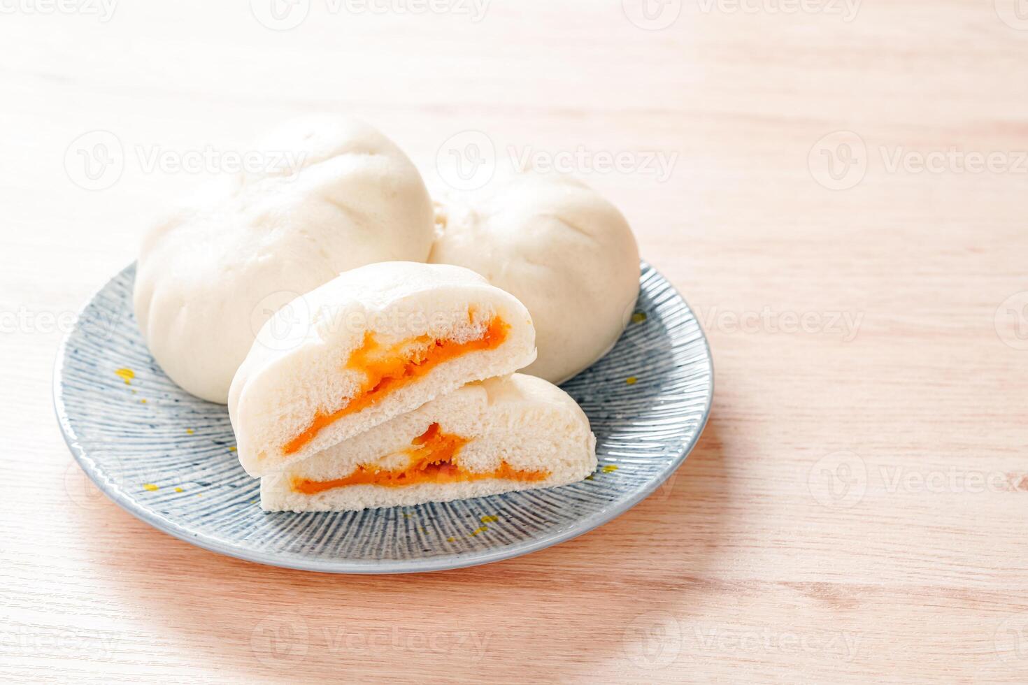 Baozi or Bakpao is a type of yeast-leavened filled bun in various Chinese cuisines. photo