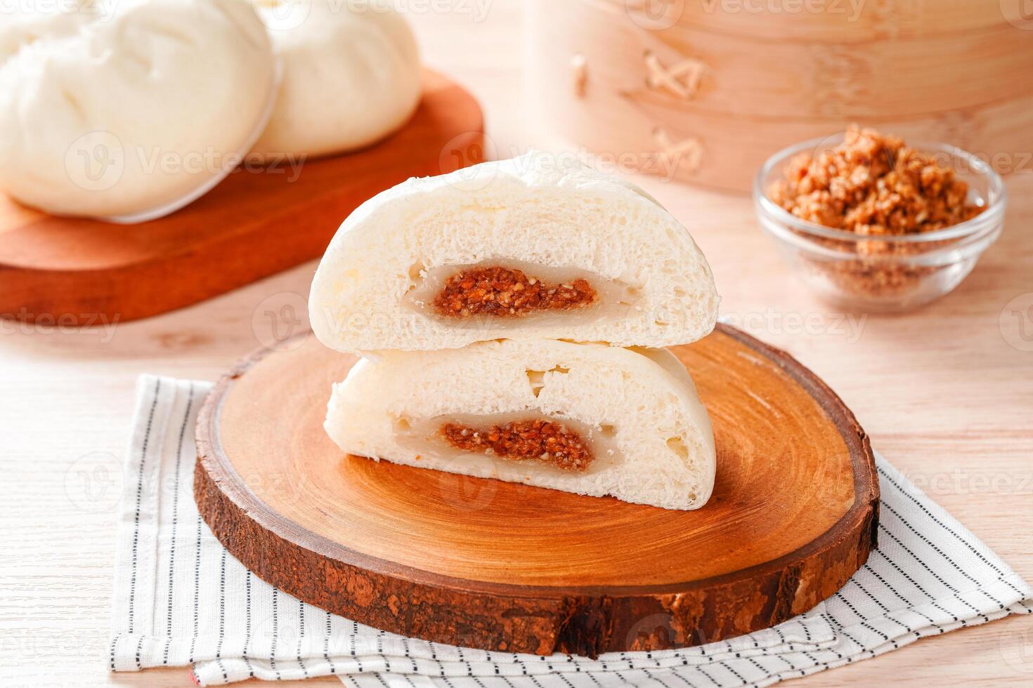 Baozi or Bakpao is a type of yeast-leavened filled bun in various Chinese cuisines. photo