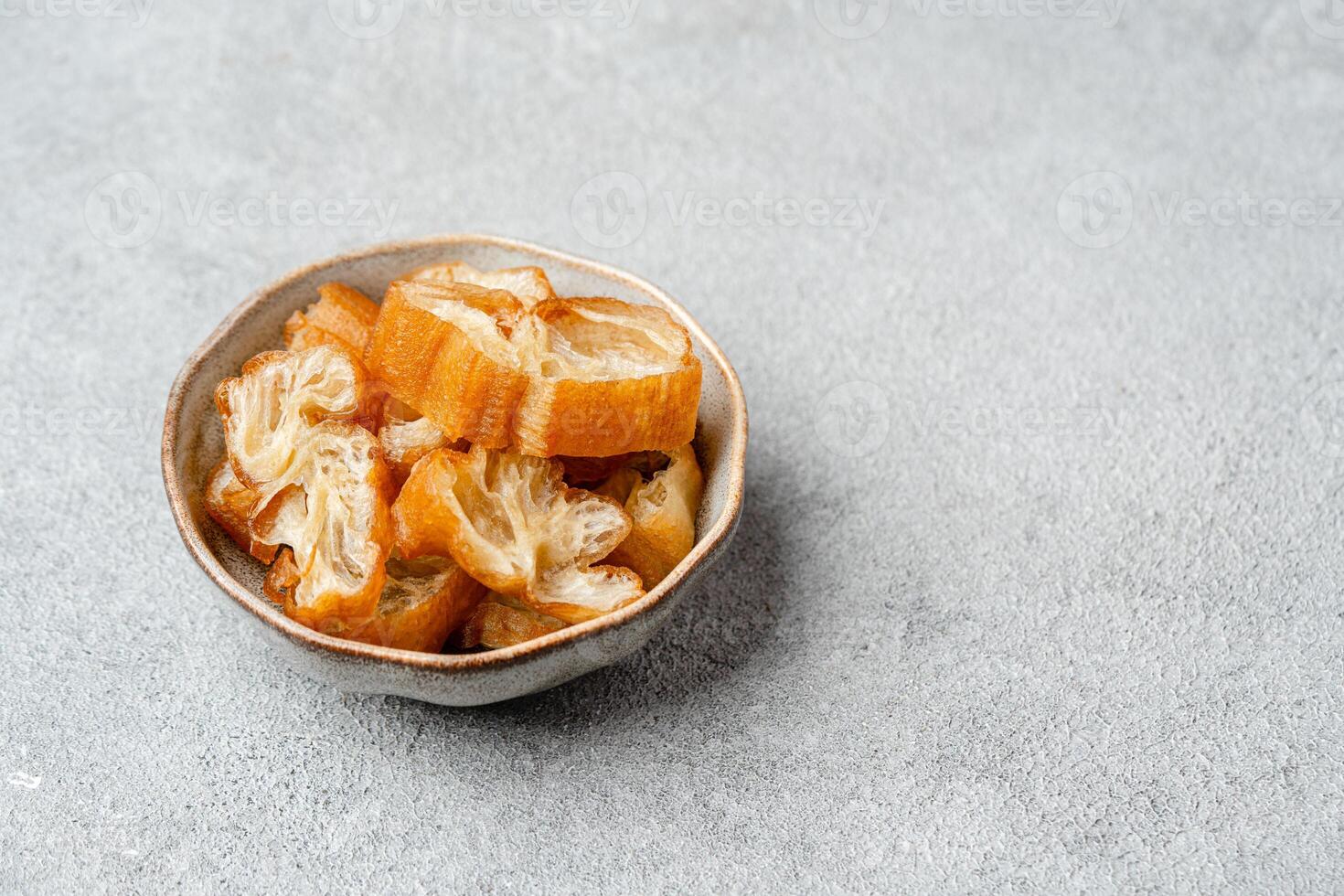 Youtiao or Yu Char Kway is a long golden brown deep-fried strip of wheat flour dough of Chinese origin photo