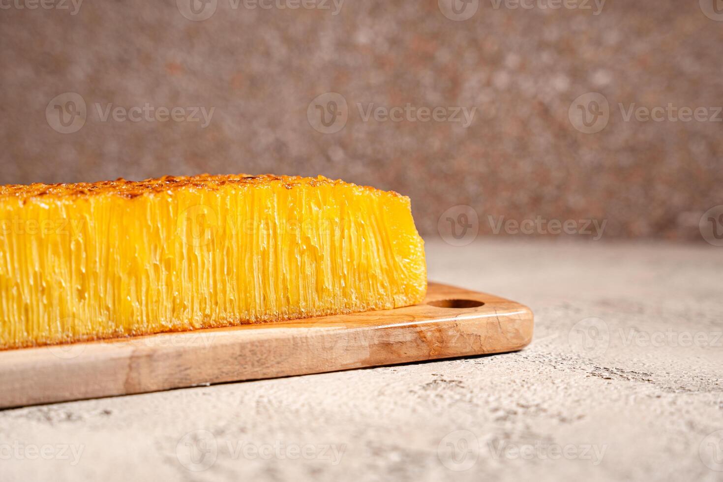 Bika ambon or golden cake or golden kuih bingka in Singapore, is an Indonesian dessert, made from ingredients such as tapioca flour, eggs, sugar, yeast and coconut milk. photo