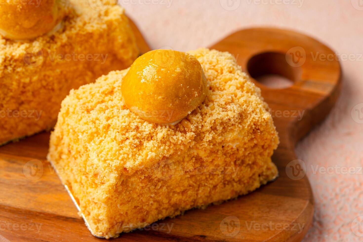 Nastar Cake is vanilla sponge based with crumbs, layered by pineapple jam and cheese cream. Topping with nastar cookies crumbs photo