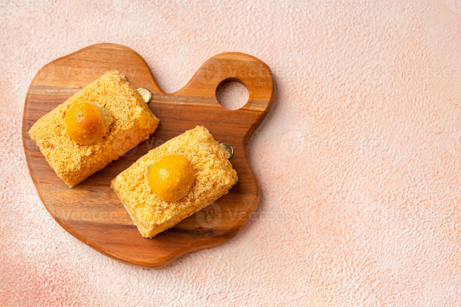 Nastar Cake is vanilla sponge based with crumbs, layered by pineapple jam and cheese cream. Topping with nastar cookies crumbs photo