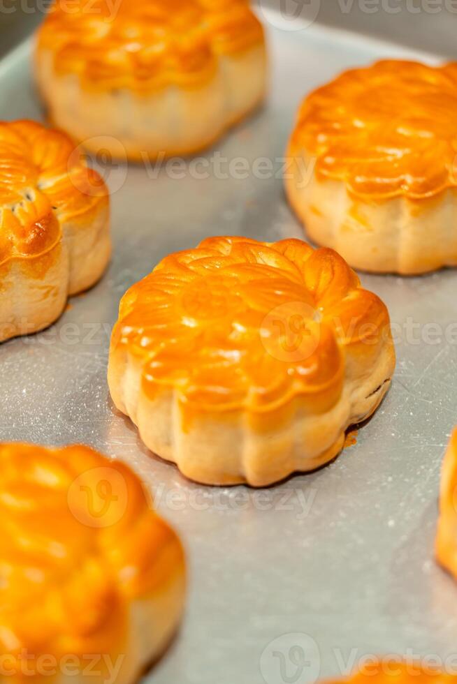 Mooncake making process. A mooncake is a Chinese bakery product traditionally eaten during the Mid Autumn Festival. photo