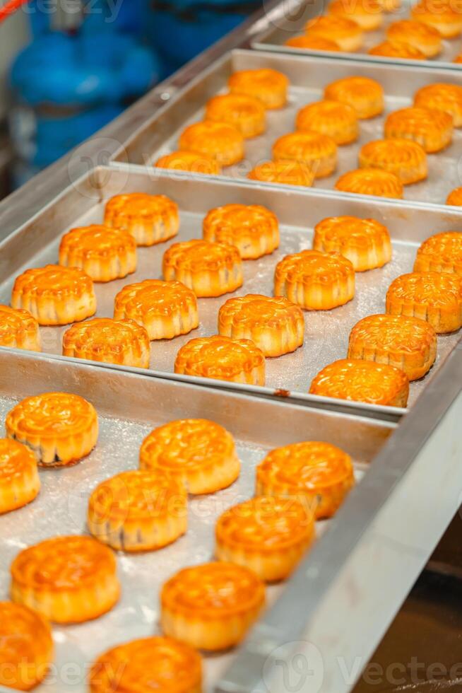 Mooncake making process. A mooncake is a Chinese bakery product traditionally eaten during the Mid Autumn Festival. photo