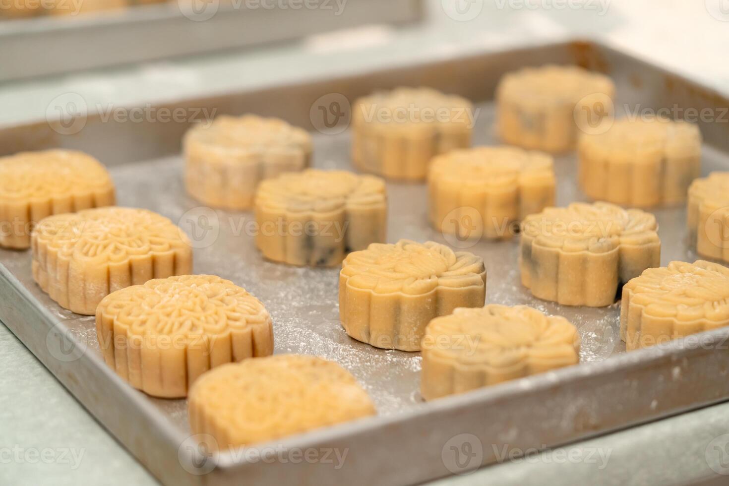 Mooncake making process. A mooncake is a Chinese bakery product traditionally eaten during the Mid Autumn Festival. photo