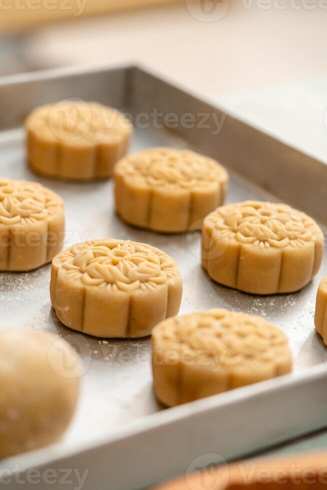 Mooncake making process. A mooncake is a Chinese bakery product traditionally eaten during the Mid Autumn Festival. photo