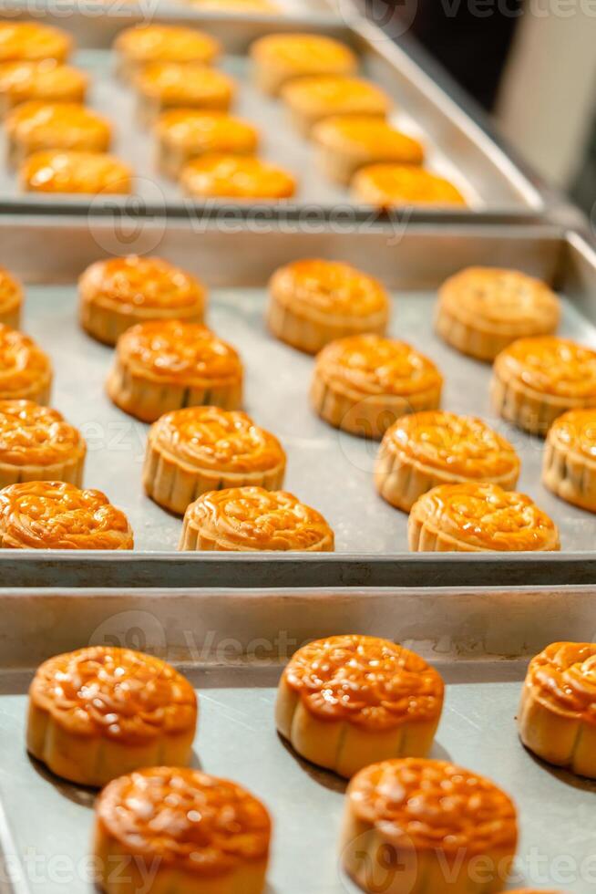 Mooncake making process. A mooncake is a Chinese bakery product traditionally eaten during the Mid Autumn Festival. photo