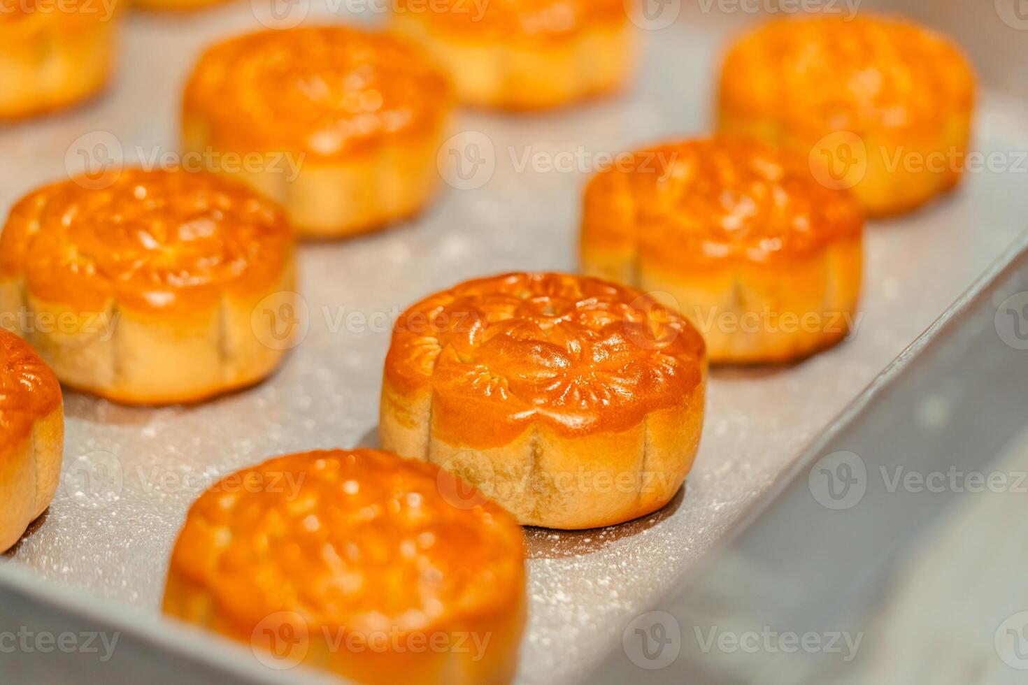 Mooncake making process. A mooncake is a Chinese bakery product traditionally eaten during the Mid Autumn Festival. photo