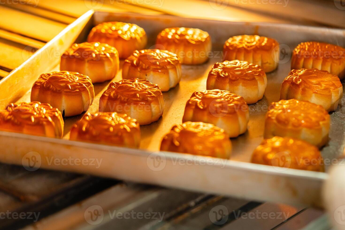 Mooncake making process. A mooncake is a Chinese bakery product traditionally eaten during the Mid Autumn Festival. photo