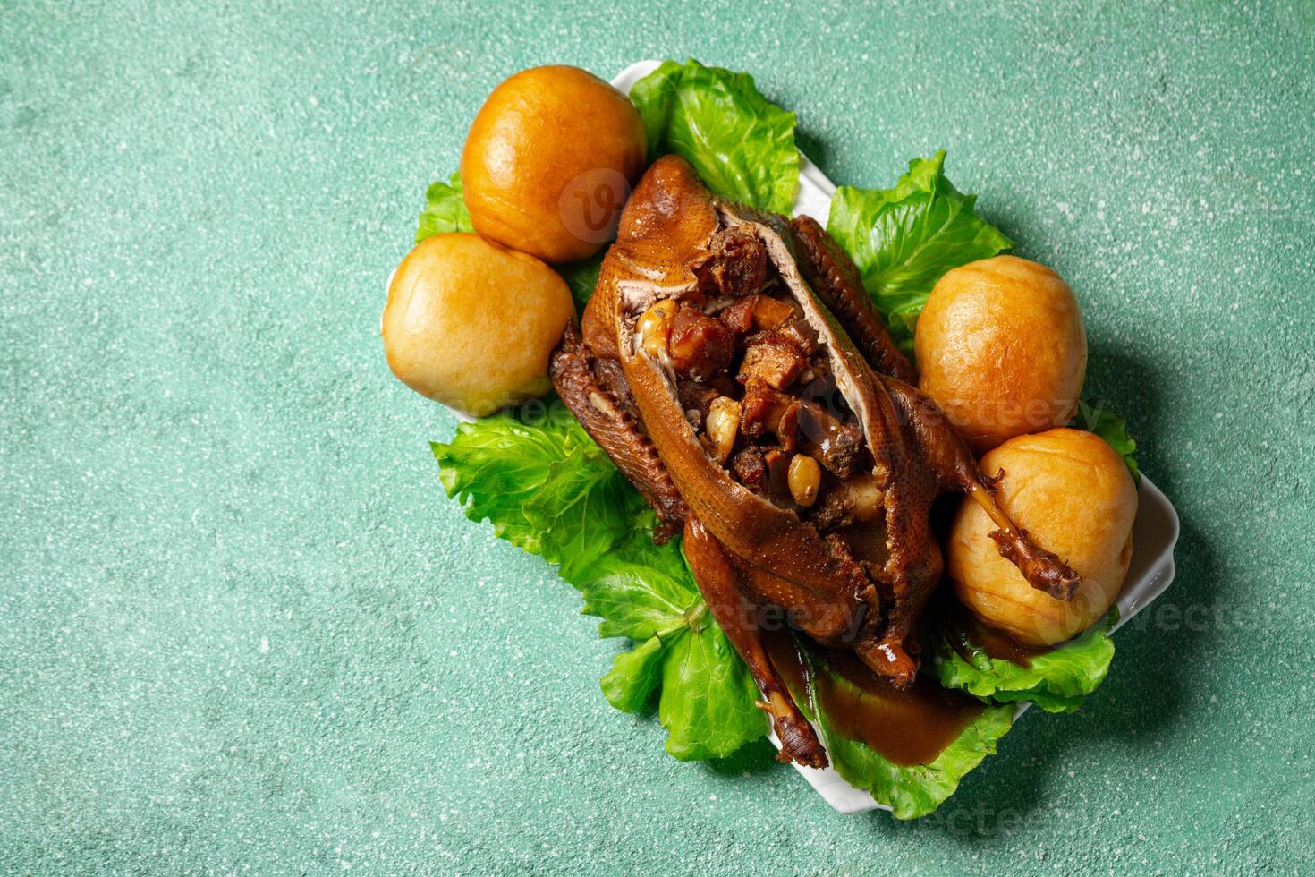Teo Chew Braised Duck with ingredients such as Roasted Pork, Chinese Sausage, Salted Egg York, Ginko nut, Mushroom inside the duck photo