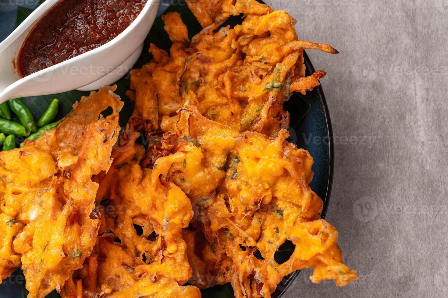 Bakwan is a vegetable fritter or gorengan from Indonesian cuisine photo