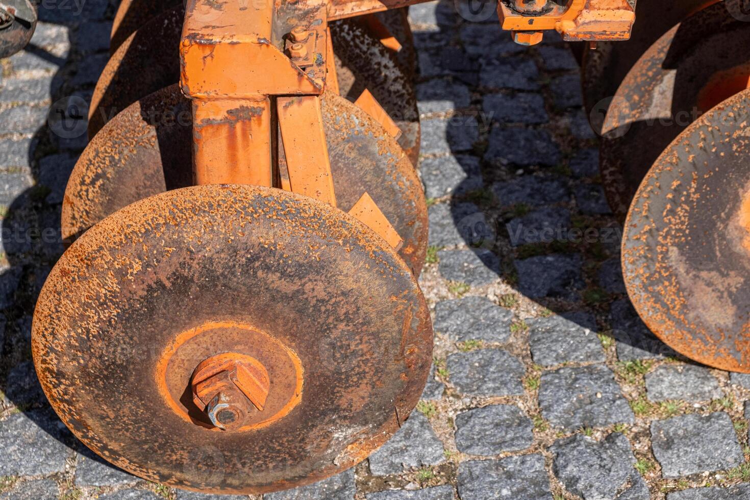 detail of an old and rusty circular plow, agricultural concept photo