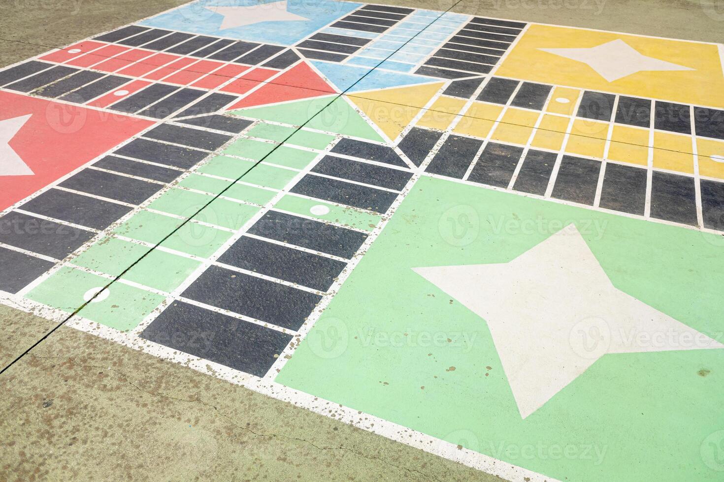 parchis board painted in a schoolyard, concept of back to school photo