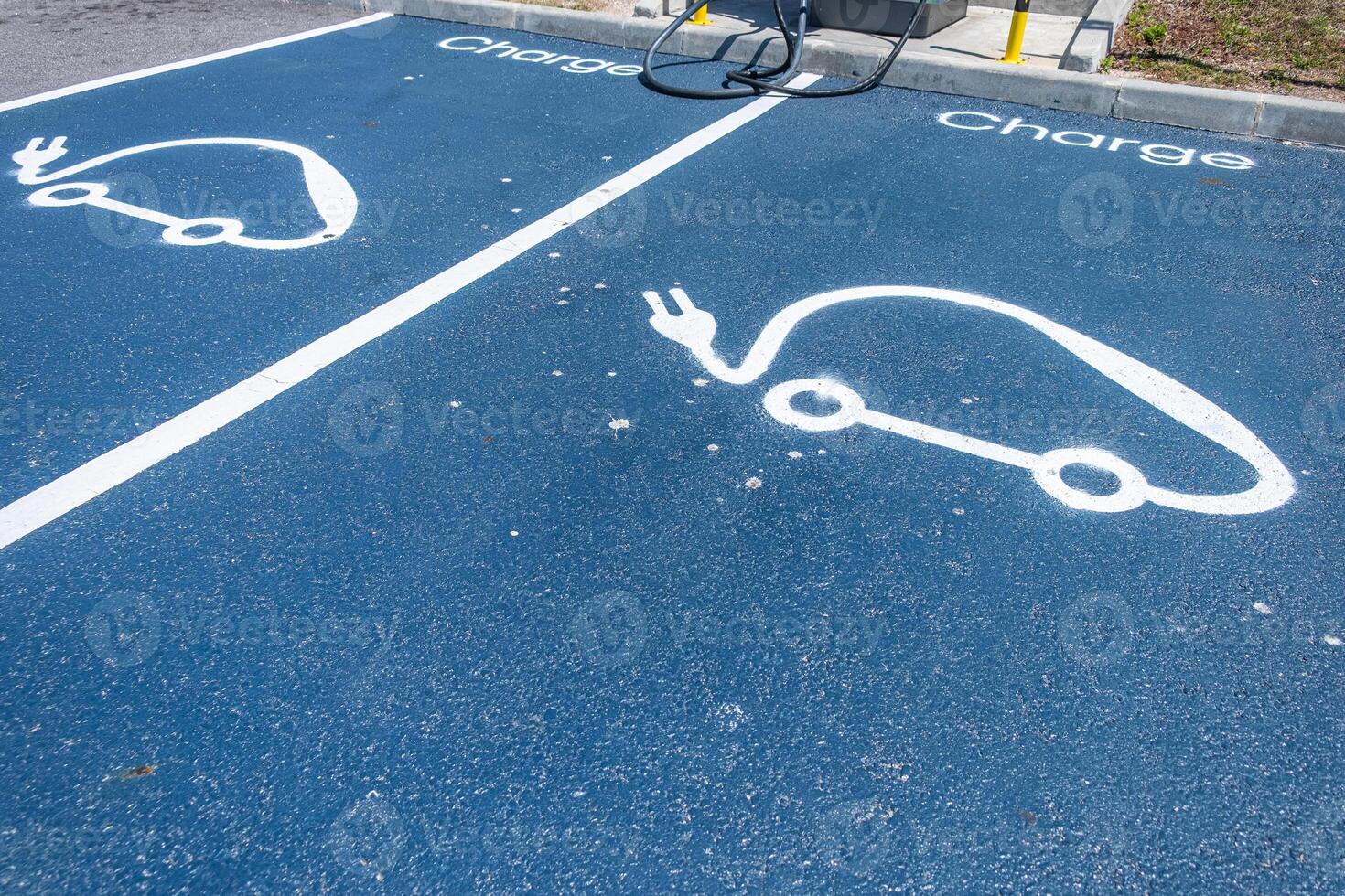 sign painted on the ground symbol for charging point for electric cars photo