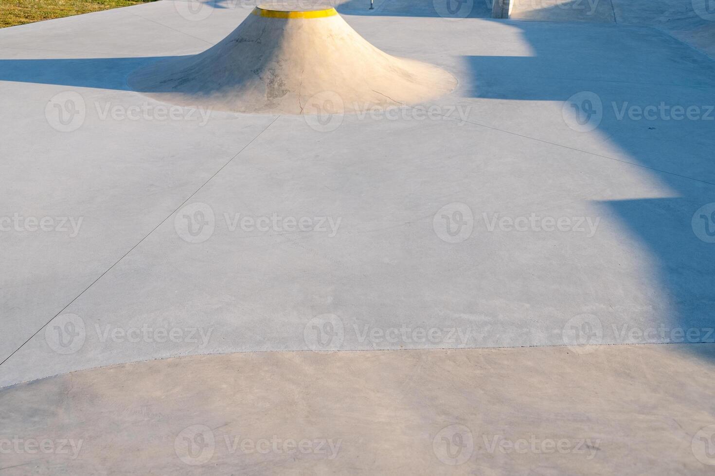 view of a ramp at a skatepark at sunset photo