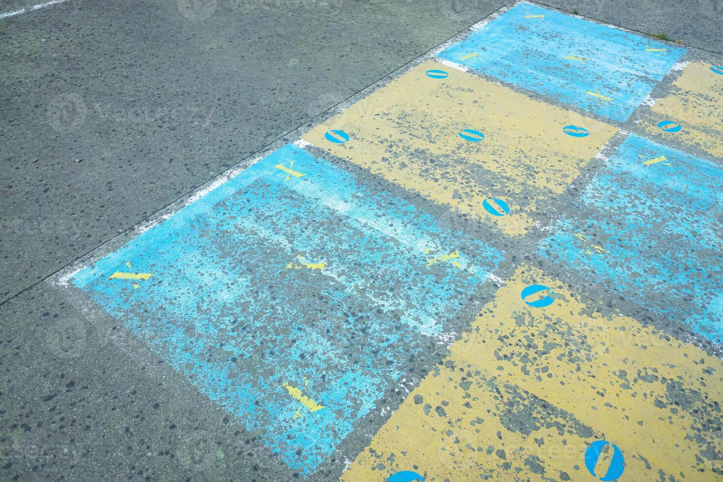 game board painted on the floor of a school playground, back to school concept photo