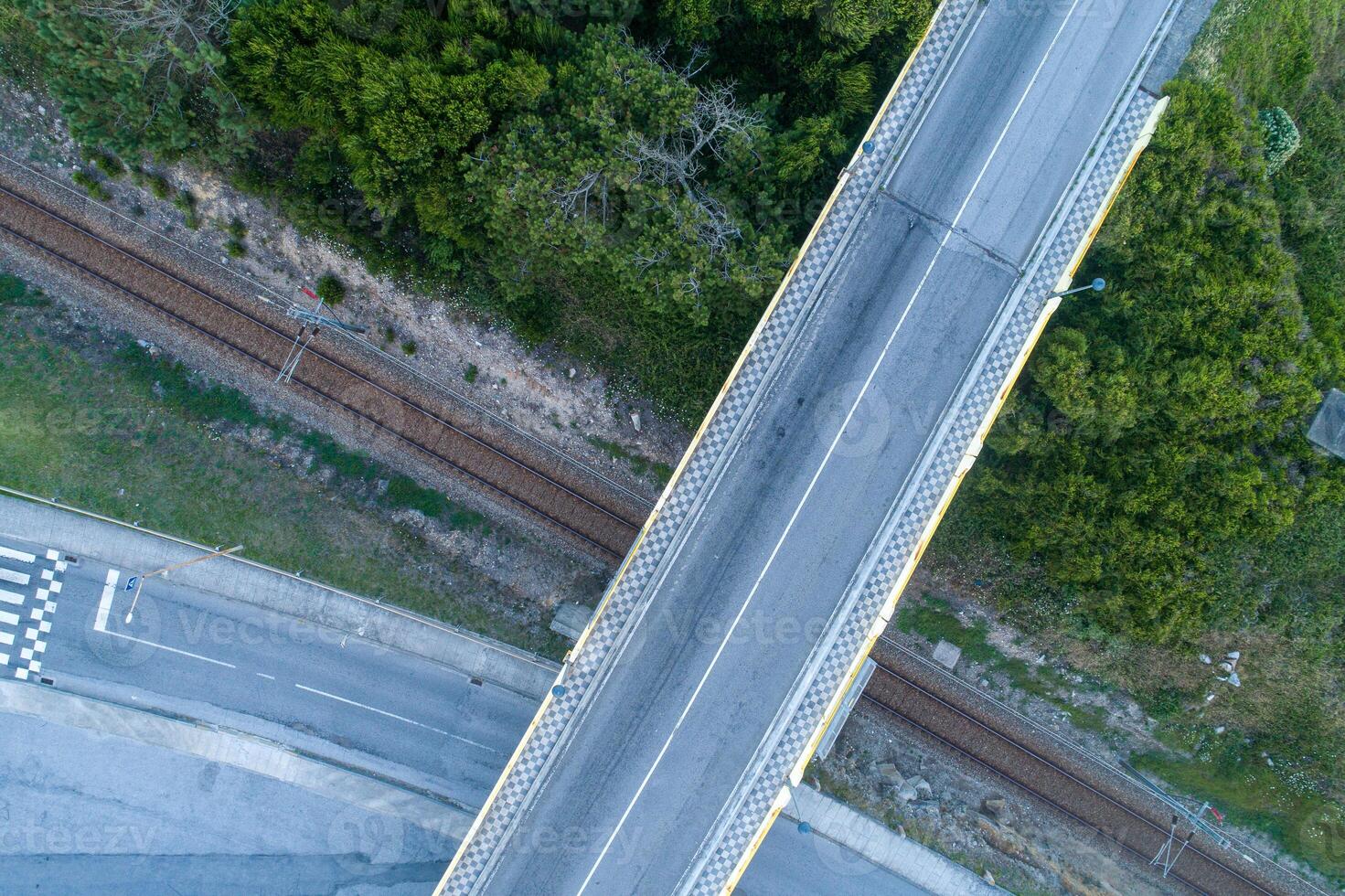overhead aerial view of a highway and railway overpass photo