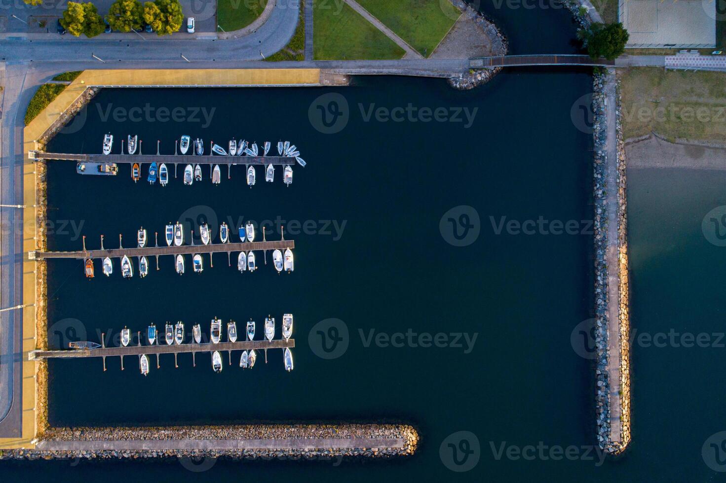 aerial top view of several boats docked at a marina photo
