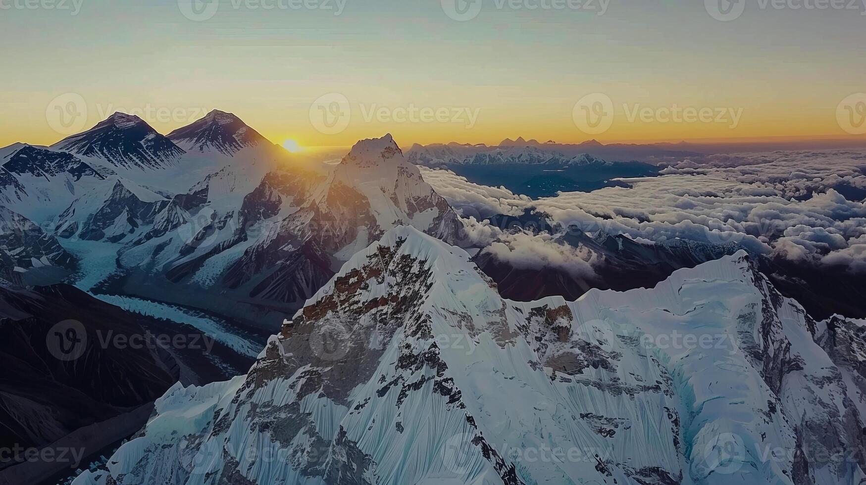 Majestic sunrise over snow-capped mountain peaks and expansive cloudscape in the Himalayas photo