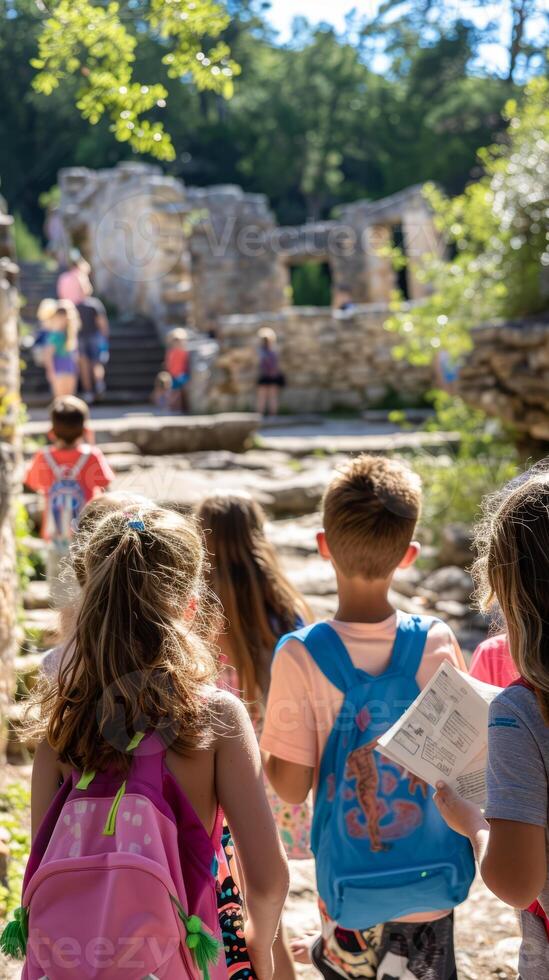 Children exploring ancient ruins on a sunny day field trip photo