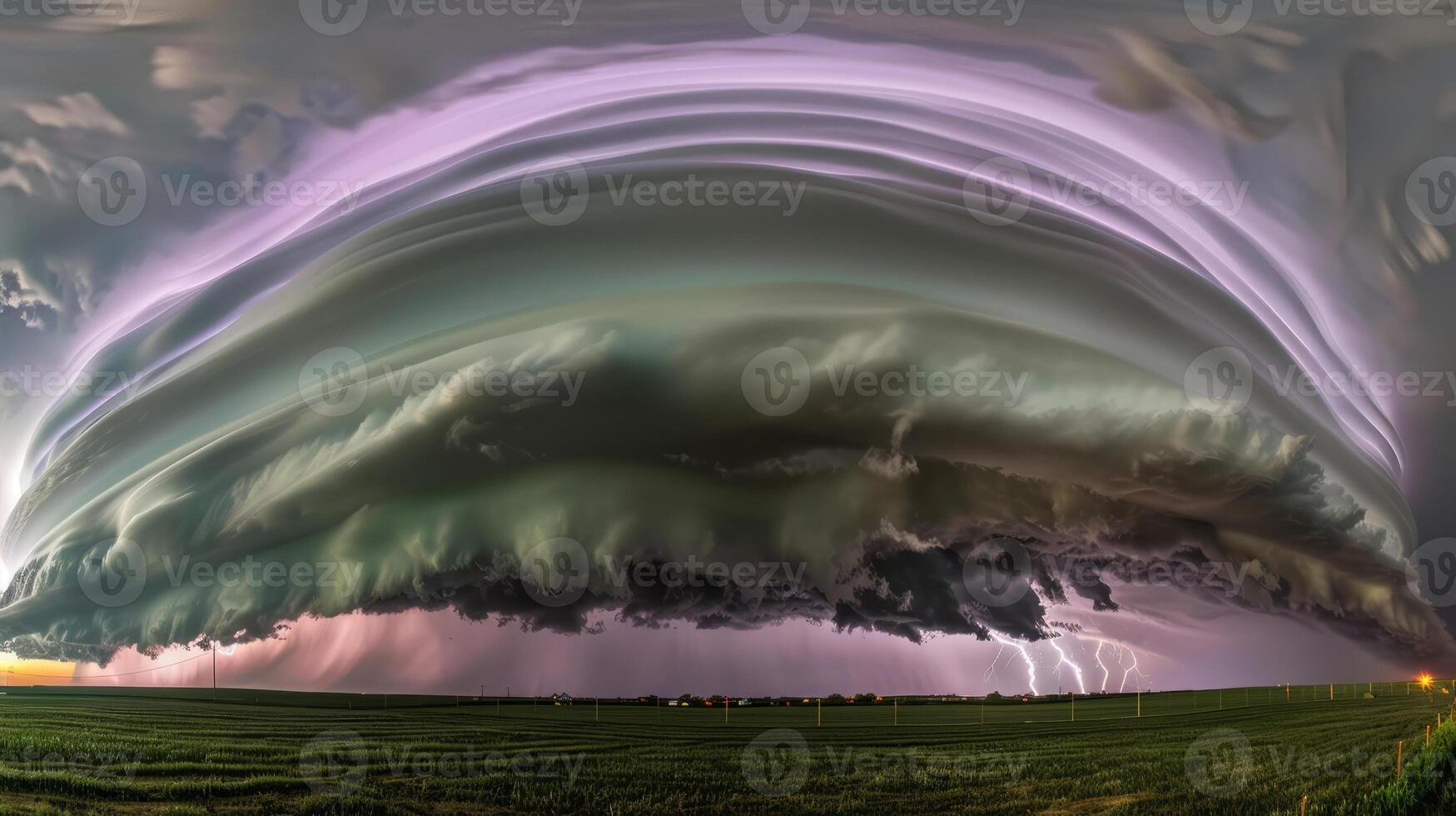 Massive supercell thunderstorm over open field with lightning photo