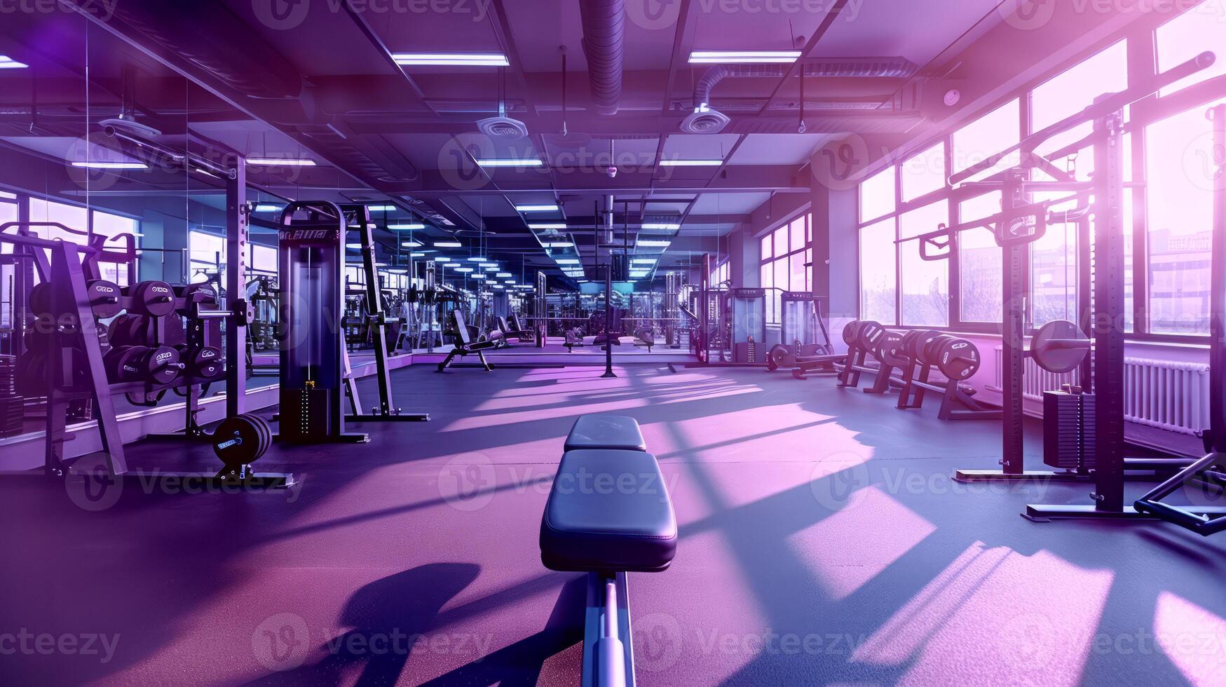 Spacious gym with natural light and state-of-the-art equipment photo