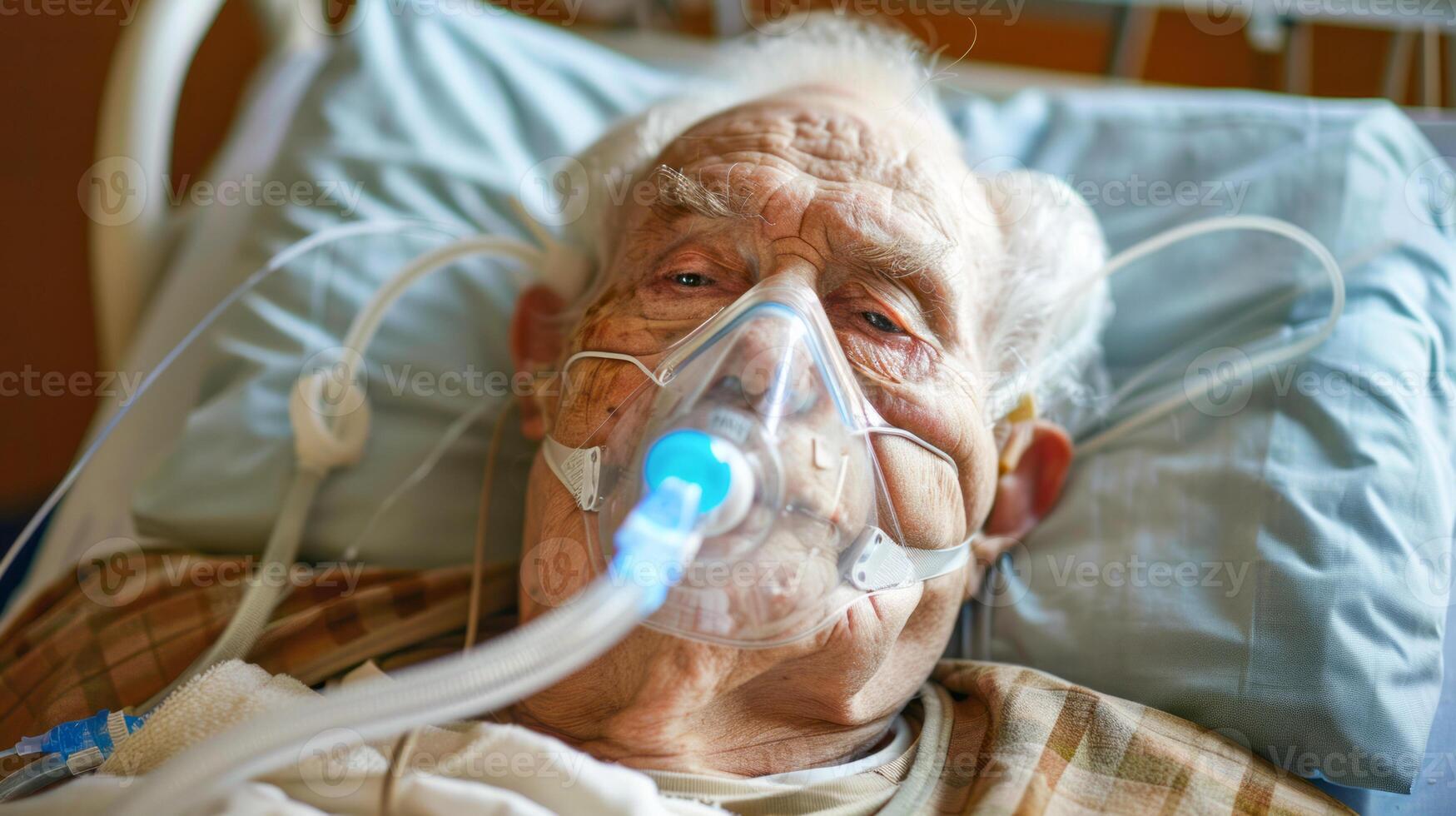 Unconscious elderly patient with oxygen mask in hospital bed photo