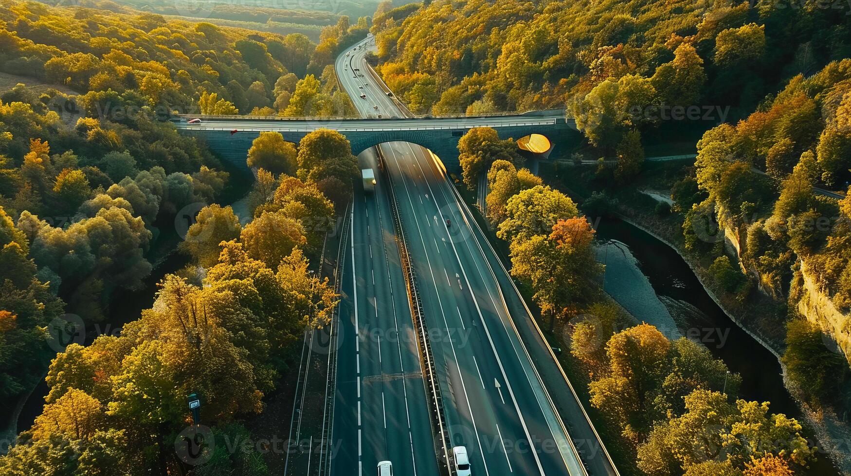 Aerial view of a highway bridge over a forested river photo