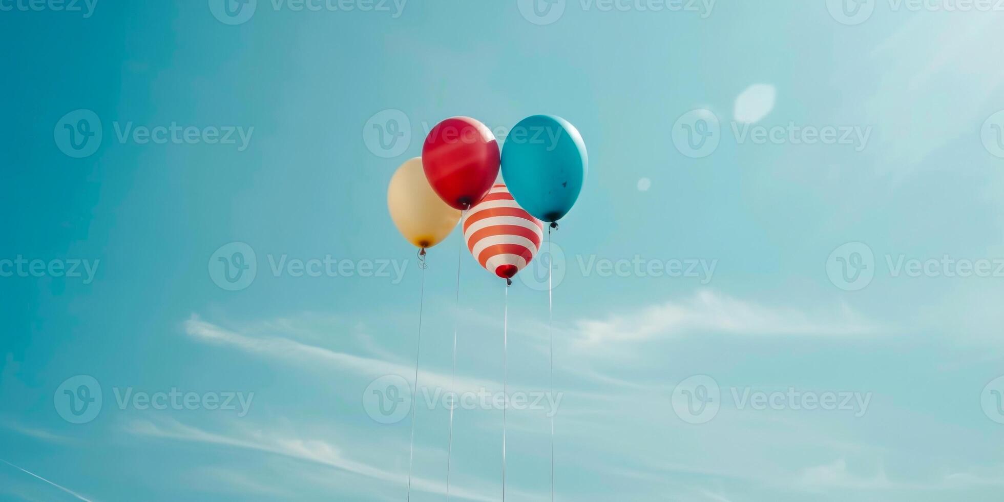 Mixed pattern balloons floating against clear sky photo